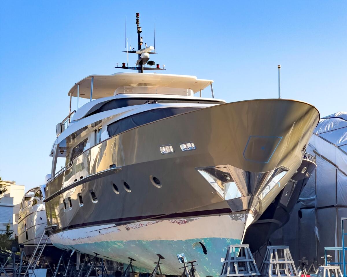 Prodotti per la Nautica da materie prime naturali: intesa tra Versalis e Gruppo Boero - A Boat yard with winter storage of power yachts and sailing boats, placed on blocks. Shipyard professional services for washing, painting and motor boat maintenance.